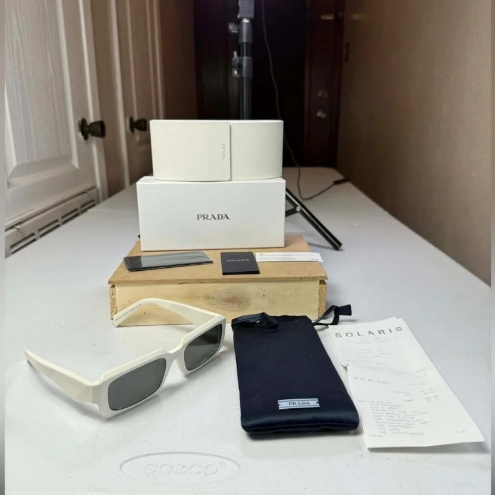 $391 Prada Symbole OPR A06SF 54MM Pillow Sunglasses | Saks Fifth Avenue